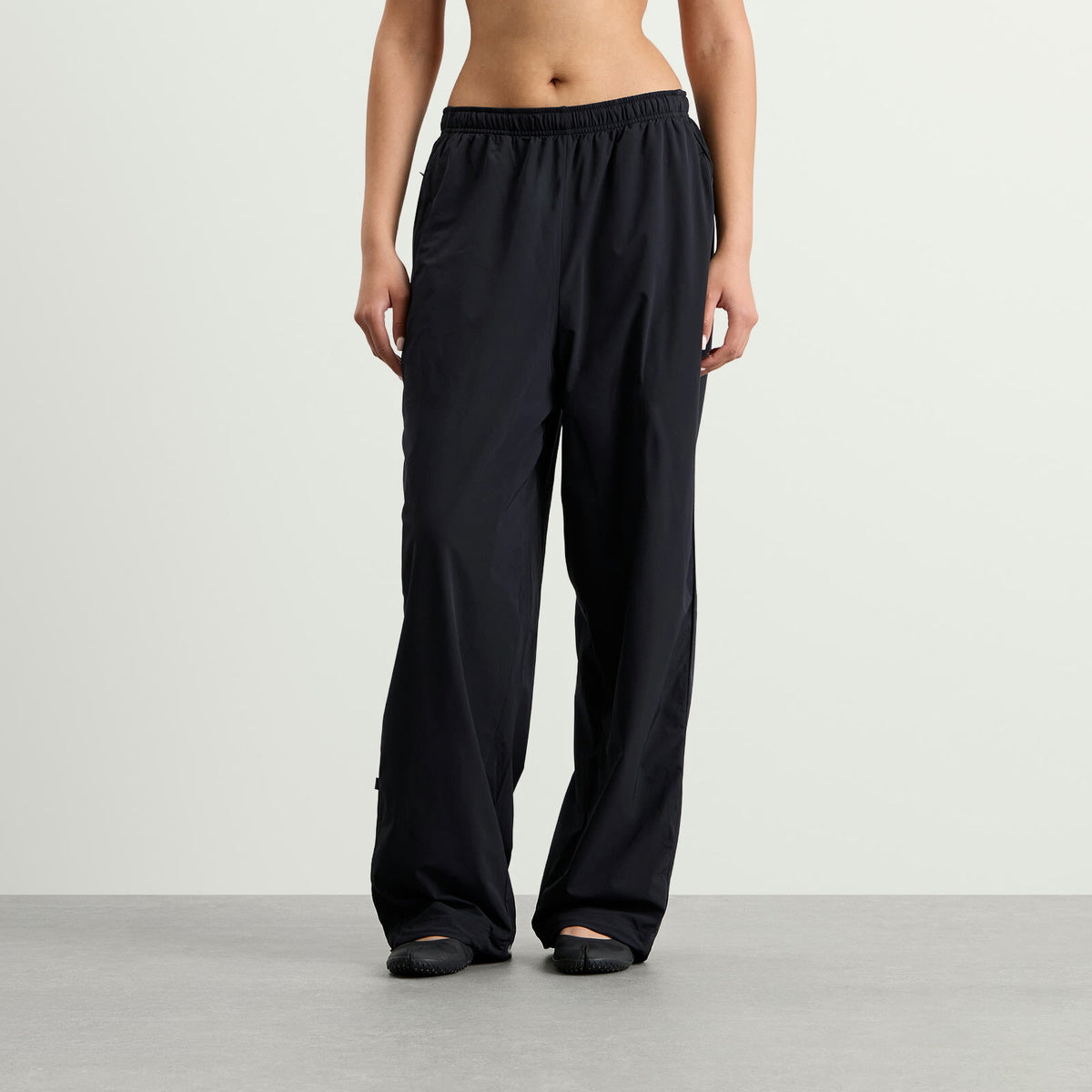 Nike Women's x SKIMS Stretch Nylon Oversized Pants in Obsidian