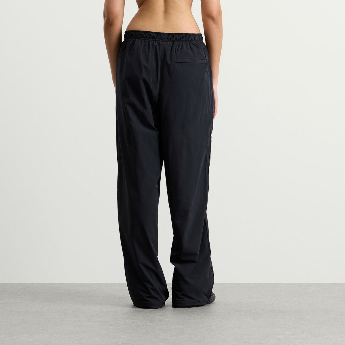 Nike Women's x SKIMS Stretch Nylon Oversized Pants in Obsidian