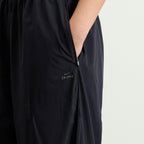 Nike Women's x SKIMS Stretch Nylon Oversized Pants in Obsidian