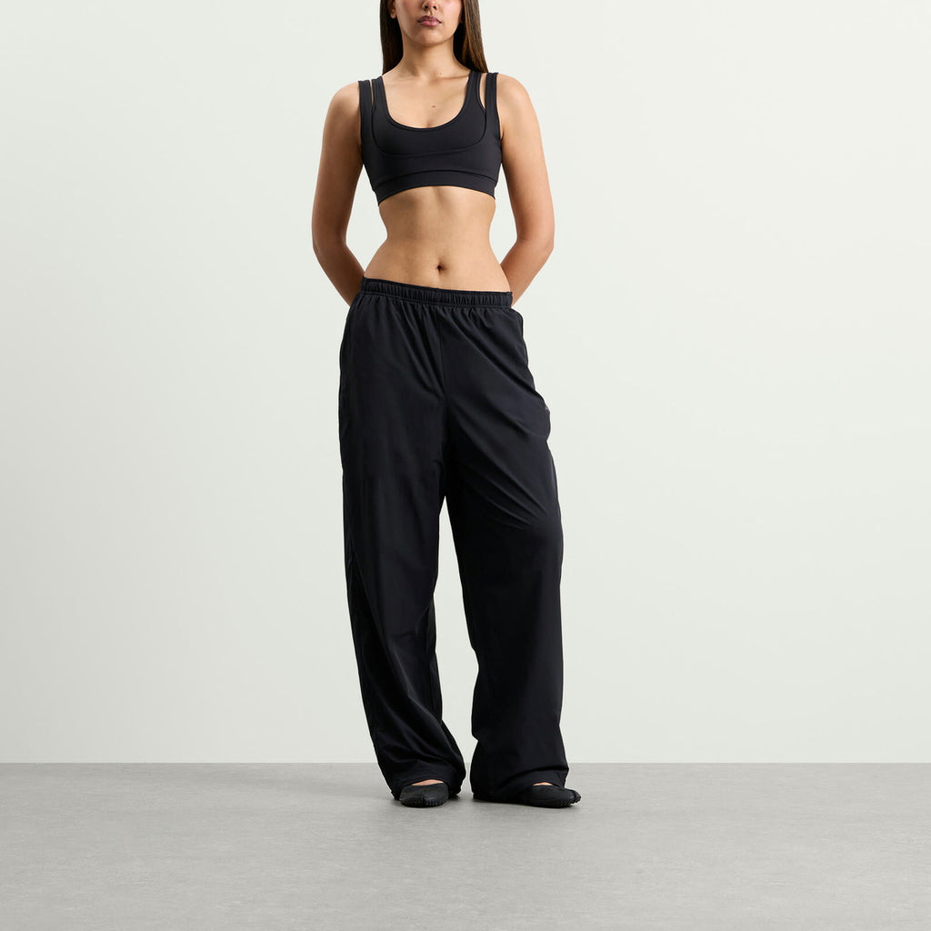 Nike Women's x SKIMS Stretch Nylon Oversized Pants in Obsidian